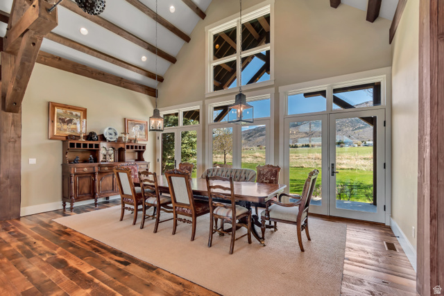 2579 Splendor Valley Road Kamas, UT 84036 - Photo 40 of 87 Dining area with a mountain view, wood finished floors, vaulted ceiling, recessed lighting, and french doors