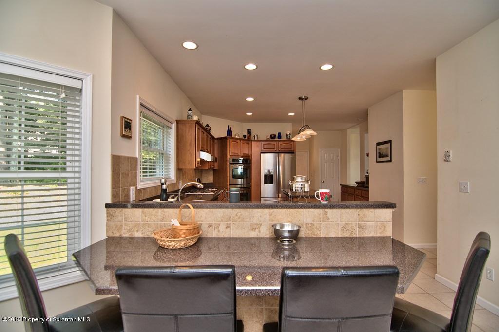 801 Forest Road Lake Ariel, PA 18436 - Photo 12 of 54 a kitchen with a sink and cabinets
