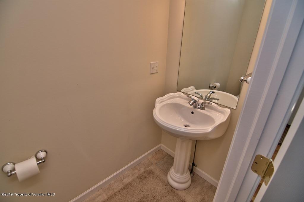 801 Forest Road Lake Ariel, PA 18436 - Photo 20 of 54 a sink and a mirror