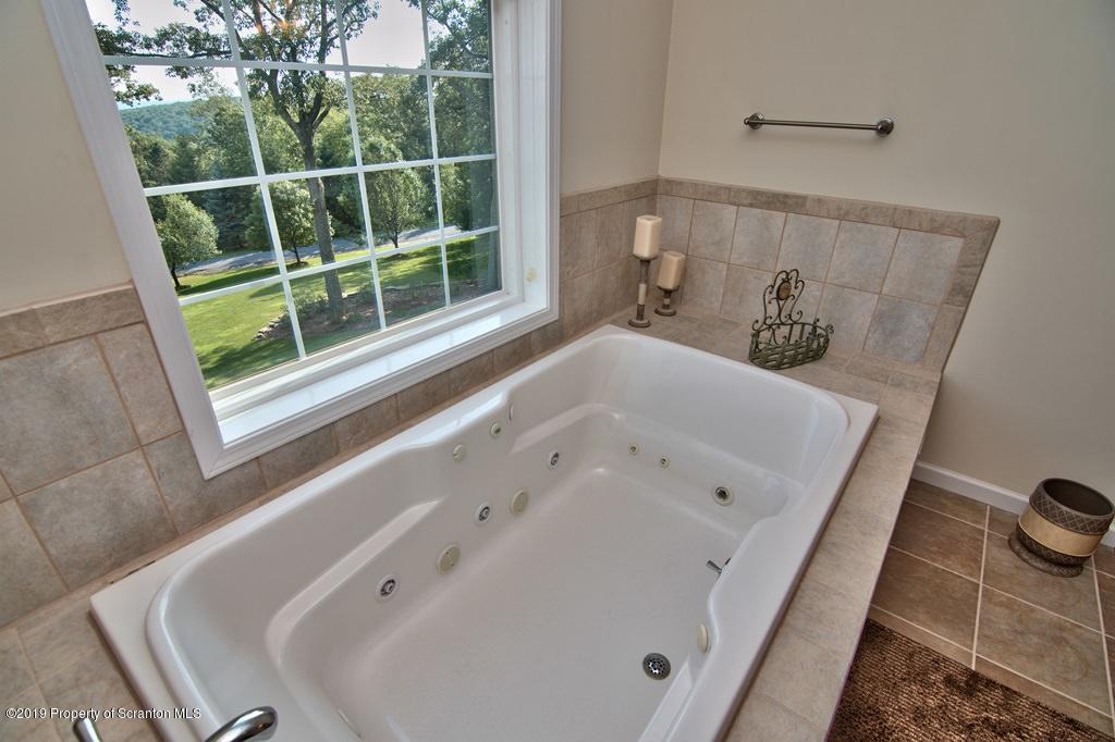 801 Forest Road Lake Ariel, PA 18436 - Photo 28 of 54 a bathroom with a tub and sink