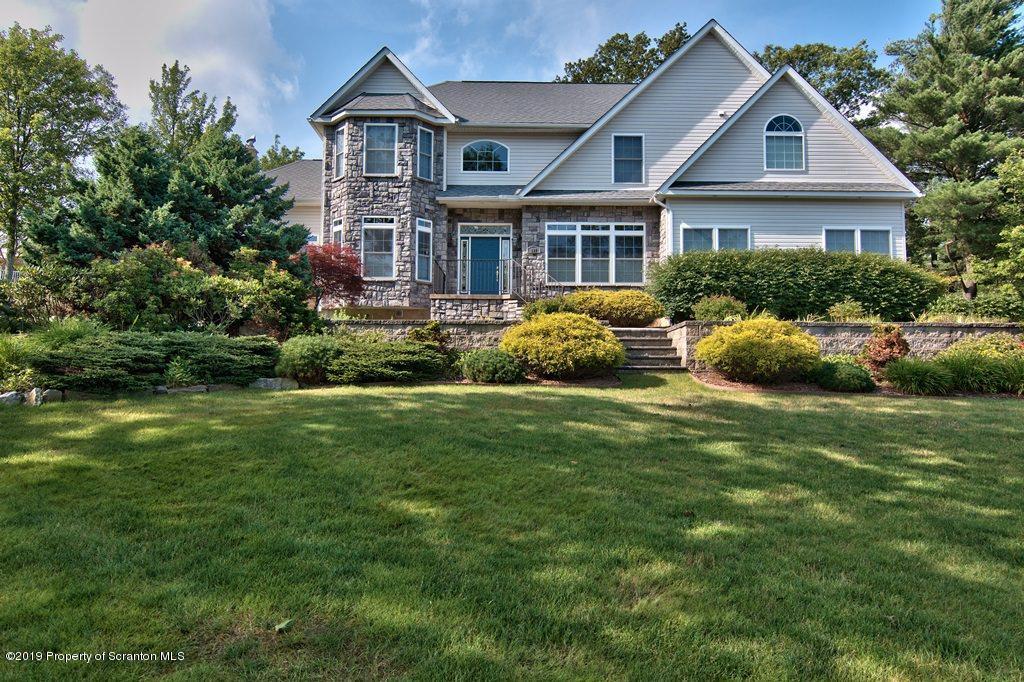 801 Forest Road Lake Ariel, PA 18436 - Photo 42 of 54 a front view of a house with a garden