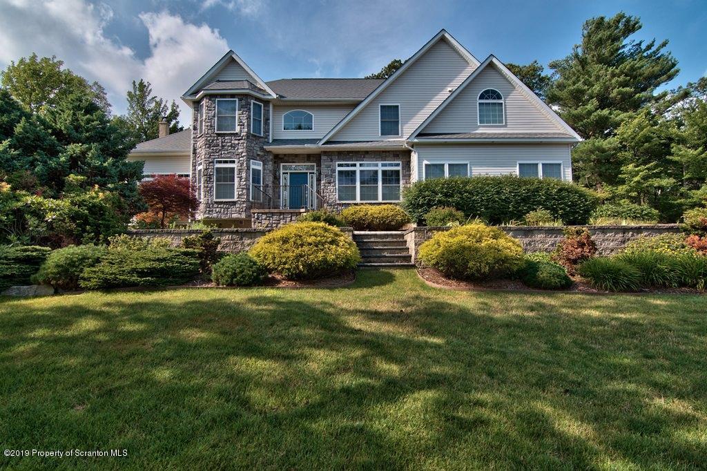 801 Forest Road Lake Ariel, PA 18436 - Photo 43 of 54 a front view of a house with a yard