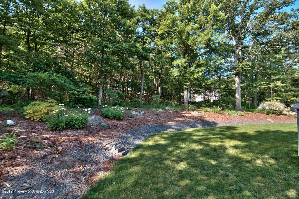 801 Forest Road Lake Ariel, PA 18436 - Photo 48 of 54 a backyard of a house with lots of green space