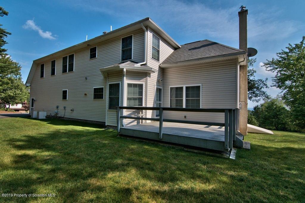 801 Forest Road Lake Ariel, PA 18436 - Photo 49 of 54 a front view of a house with a yard