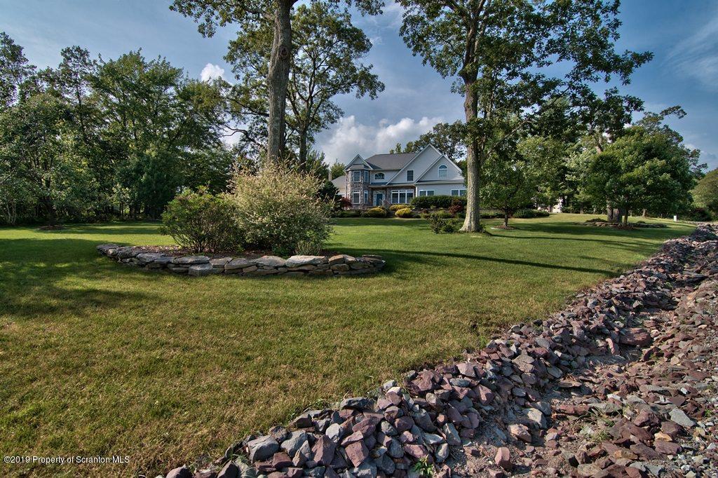 801 Forest Road Lake Ariel, PA 18436 - Photo 54 of 54 a view of a house with a big yard and large trees