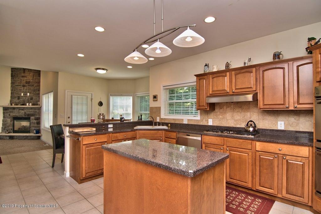 801 Forest Road Lake Ariel, PA 18436 - Photo 8 of 54 a kitchen with stainless steel appliances granite countertop a sink and cabinets