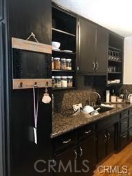 1139 East Ocean Boulevard, Unit 109 Long Beach, CA 90802 - Photo 12 of 14 a kitchen with a sink and cabinets