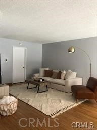 1139 East Ocean Boulevard, Unit 109 Long Beach, CA 90802 - Photo 8 of 14 a living room with furniture