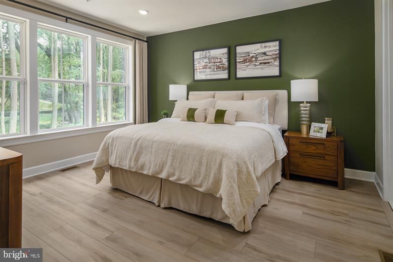 9434 Founders Lane Perry Hall, MD 21128 - Photo 6 of 18 a bedroom with a bed and wooden floor