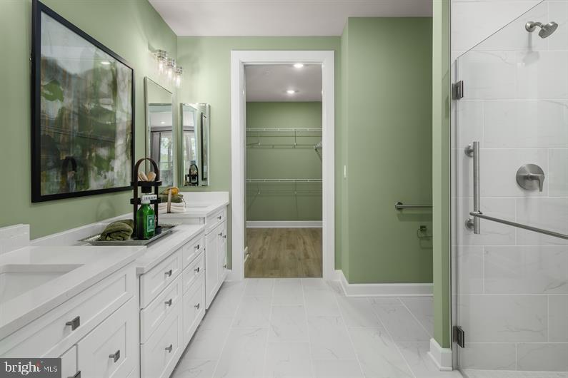 9434 Founders Lane Perry Hall, MD 21128 - Photo 7 of 18 a bathroom with a granite countertop shower sink and mirror