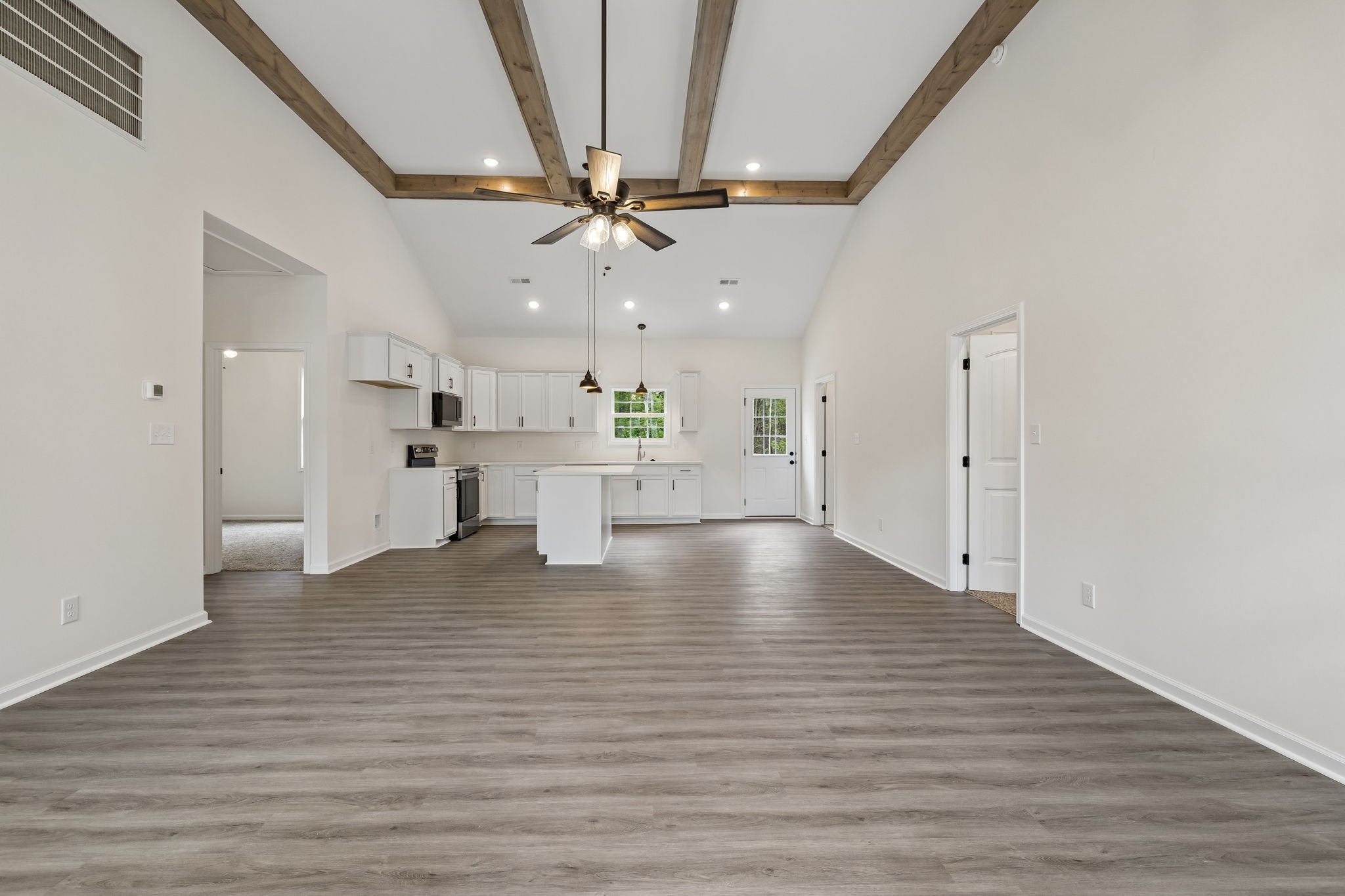 613 Hill Road Clarksville, TN 37040 - Photo 6 of 30 a view of an empty room with a window and wooden floor