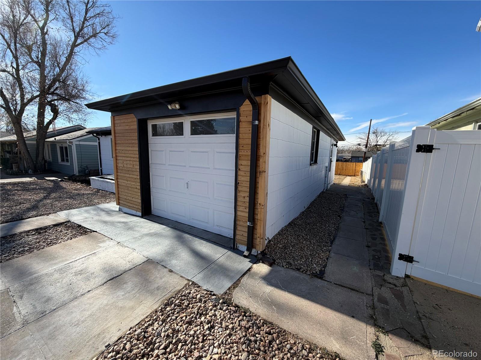 1173 Ironton Street Aurora, CO 80010 - Photo 5 of 28 a view of a house with a wooden fence