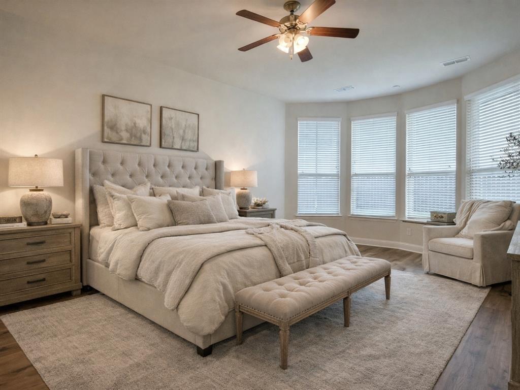 3044 Bold Ruler Road Celina, TX 75009 - Photo 11 of 36 a spacious bedroom with a bed and a couch