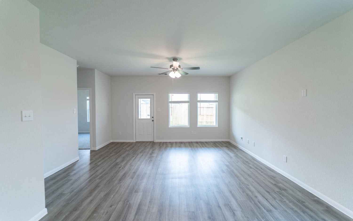 4326 Maple Root Lane Pinehurst, TX 77362 - Photo 12 of 27 wooden floor in an empty room with a window