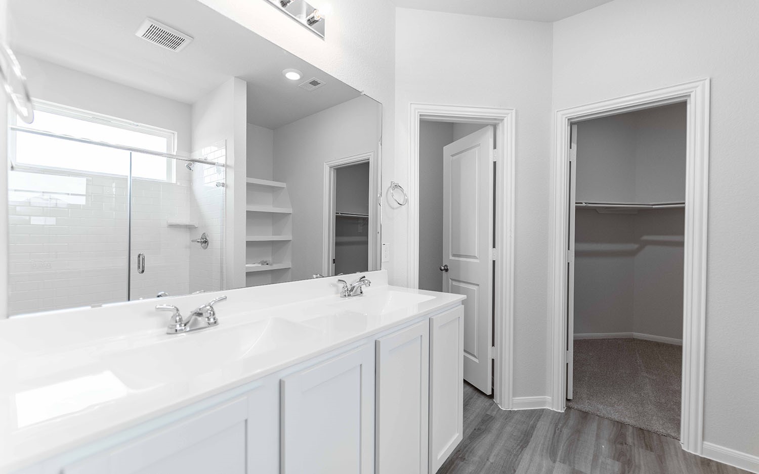 4326 Maple Root Lane Pinehurst, TX 77362 - Photo 15 of 27 a bathroom with a sink double vanity and a mirror