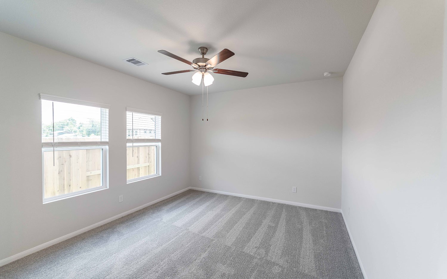 4326 Maple Root Lane Pinehurst, TX 77362 - Photo 16 of 27 wooden floor in an empty room with a window