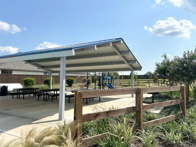 a view of a swimming pool outdoor seating