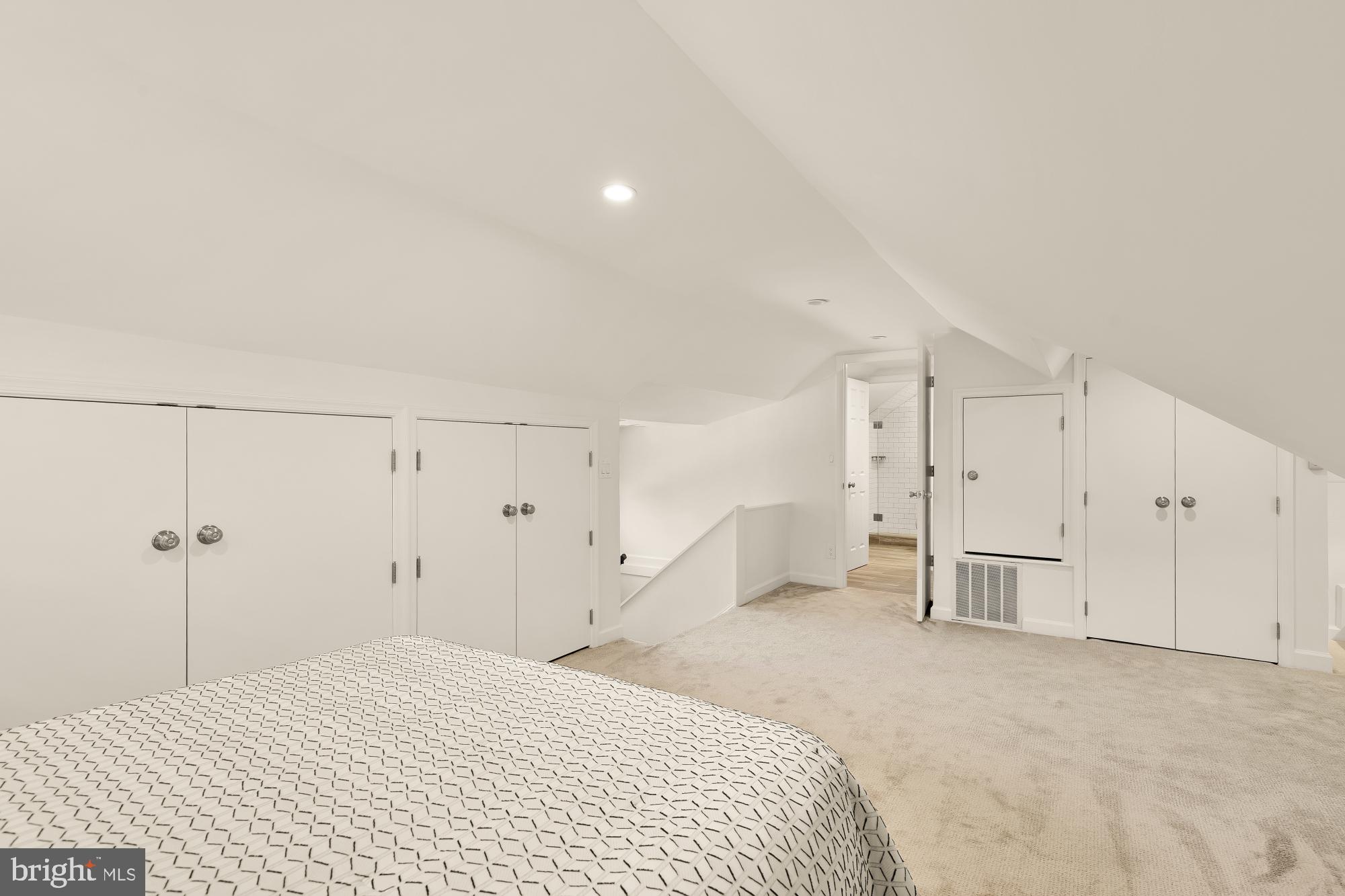 3707 Military Road Northwest Washington, DC 20015 - Photo 35 of 60 a spacious bedroom with a bed and cabinets