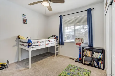 a bedroom with furniture and a window
