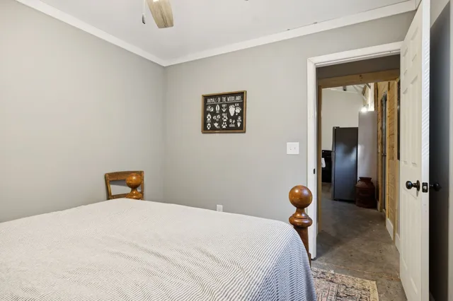 a bedroom with a bed and cabinets