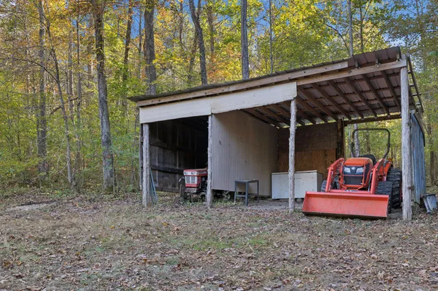 a view of house with couch and outdoor seating