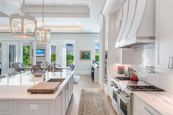 a kitchen with stove and cabinets
