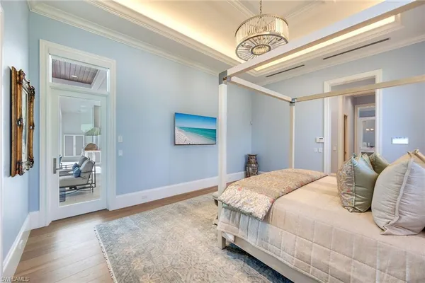 a bedroom with a large bed and walk in closet