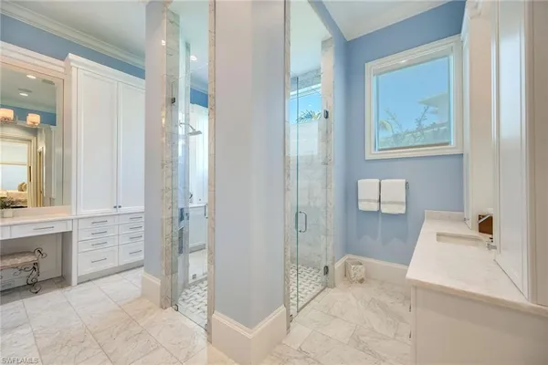 a bathroom with a tub and shower