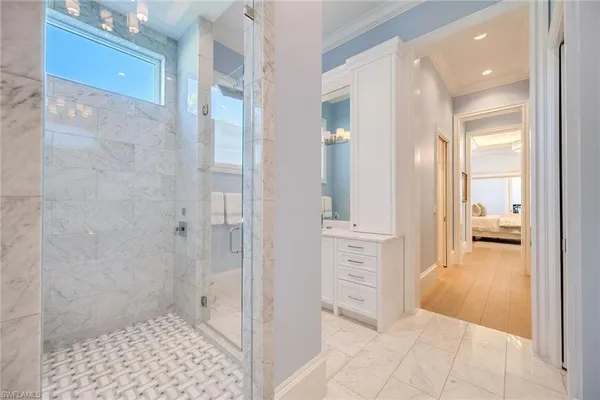 a bathroom with a shower and a sink