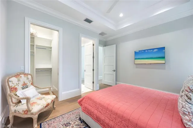 a bedroom with a bed and chair