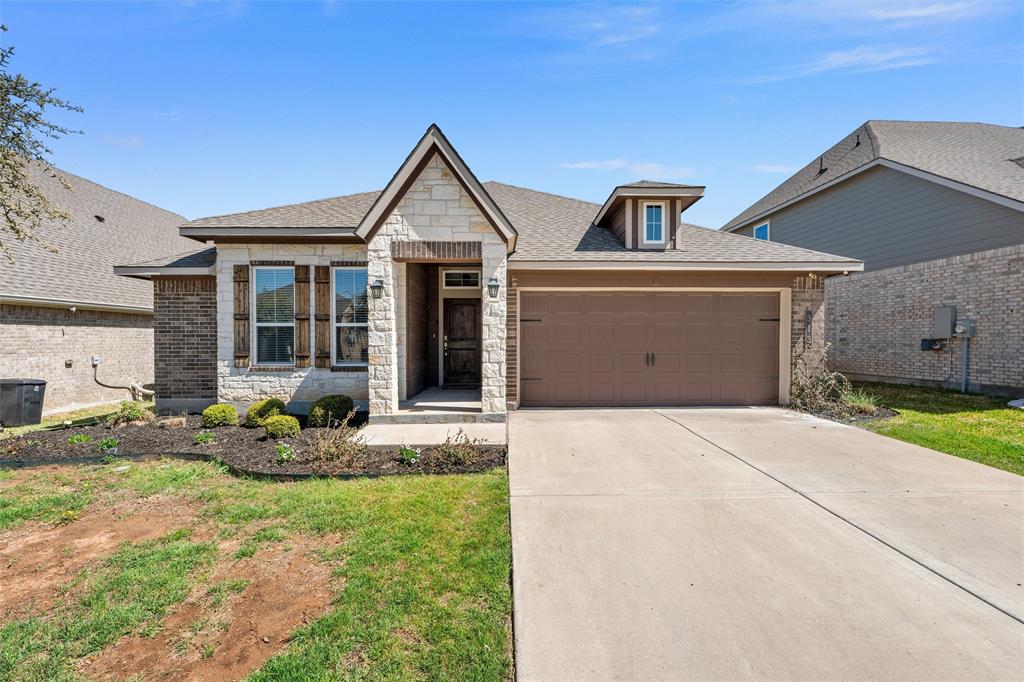 313 Branch Road Woodway, TX 76712 - Photo 1 of 16 a front view of a house with garden