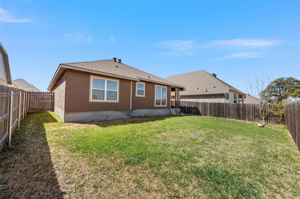 313 Branch Road Woodway, TX 76712 - Photo 14 of 16 a front view of a house with garden