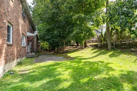 a view of a backyard with a small cabin