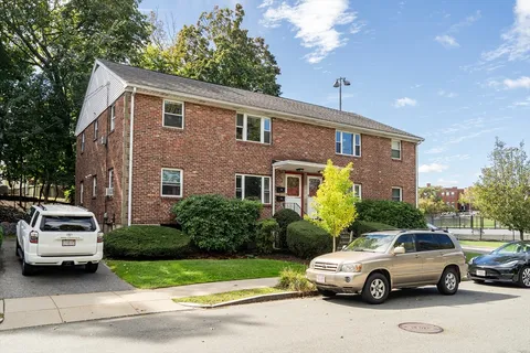 a car parked in front of a house