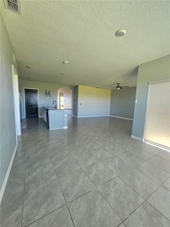 2853 Grandbury Grove Road Lakeland, FL 33811 - Photo 11 of 25 a view of empty room with kitchen and window