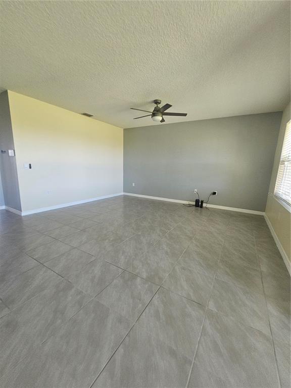 2853 Grandbury Grove Road Lakeland, FL 33811 - Photo 12 of 25 an empty room with a empty space and windows