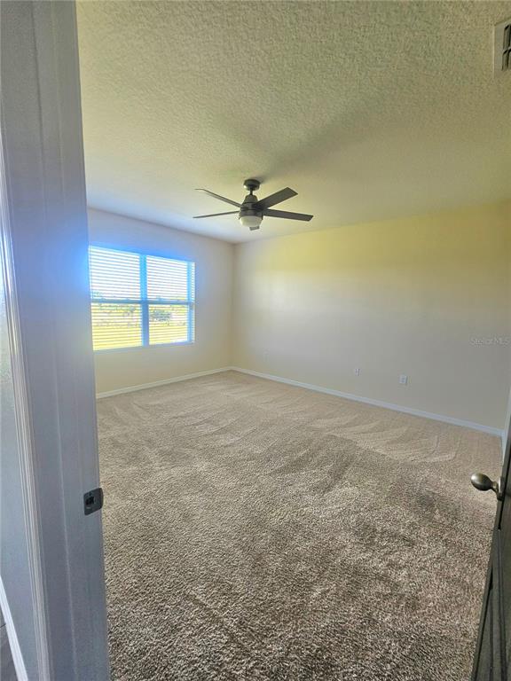 2853 Grandbury Grove Road Lakeland, FL 33811 - Photo 13 of 25 an empty room with a window