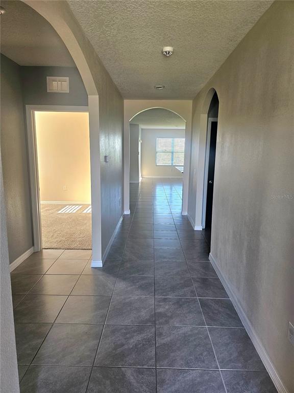 2853 Grandbury Grove Road Lakeland, FL 33811 - Photo 2 of 25 a view of a hallway
