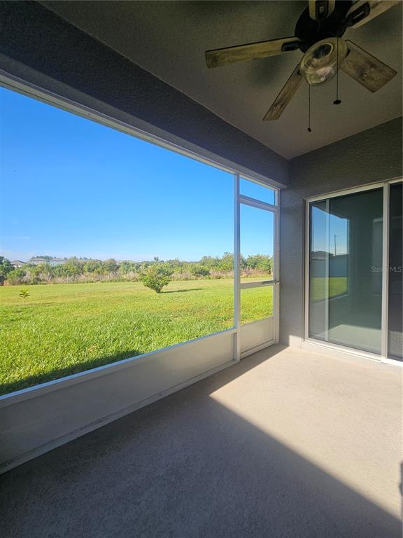 2853 Grandbury Grove Road Lakeland, FL 33811 - Photo 25 of 25 a view of ocean with a floor to ceiling window and an ocean view