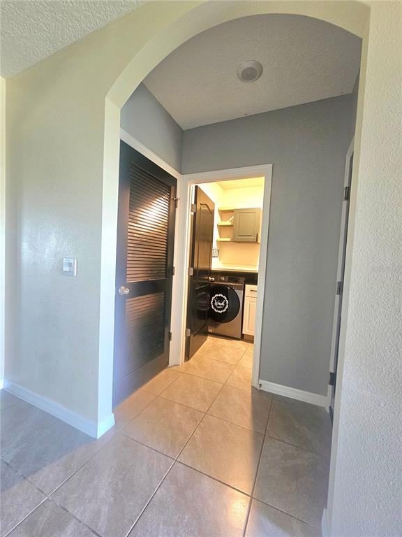 2853 Grandbury Grove Road Lakeland, FL 33811 - Photo 8 of 25 a view of a hallway with a washer and dryer
