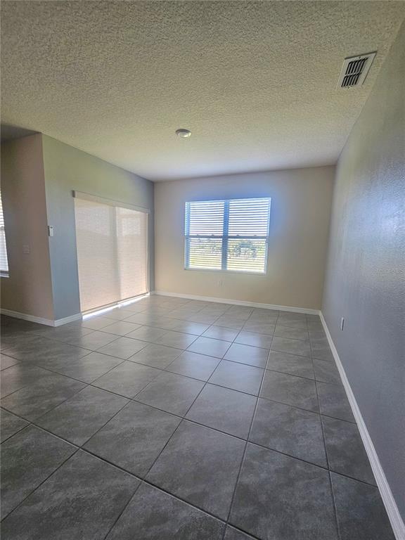2853 Grandbury Grove Road Lakeland, FL 33811 - Photo 10 of 25 a view of an empty room with a window