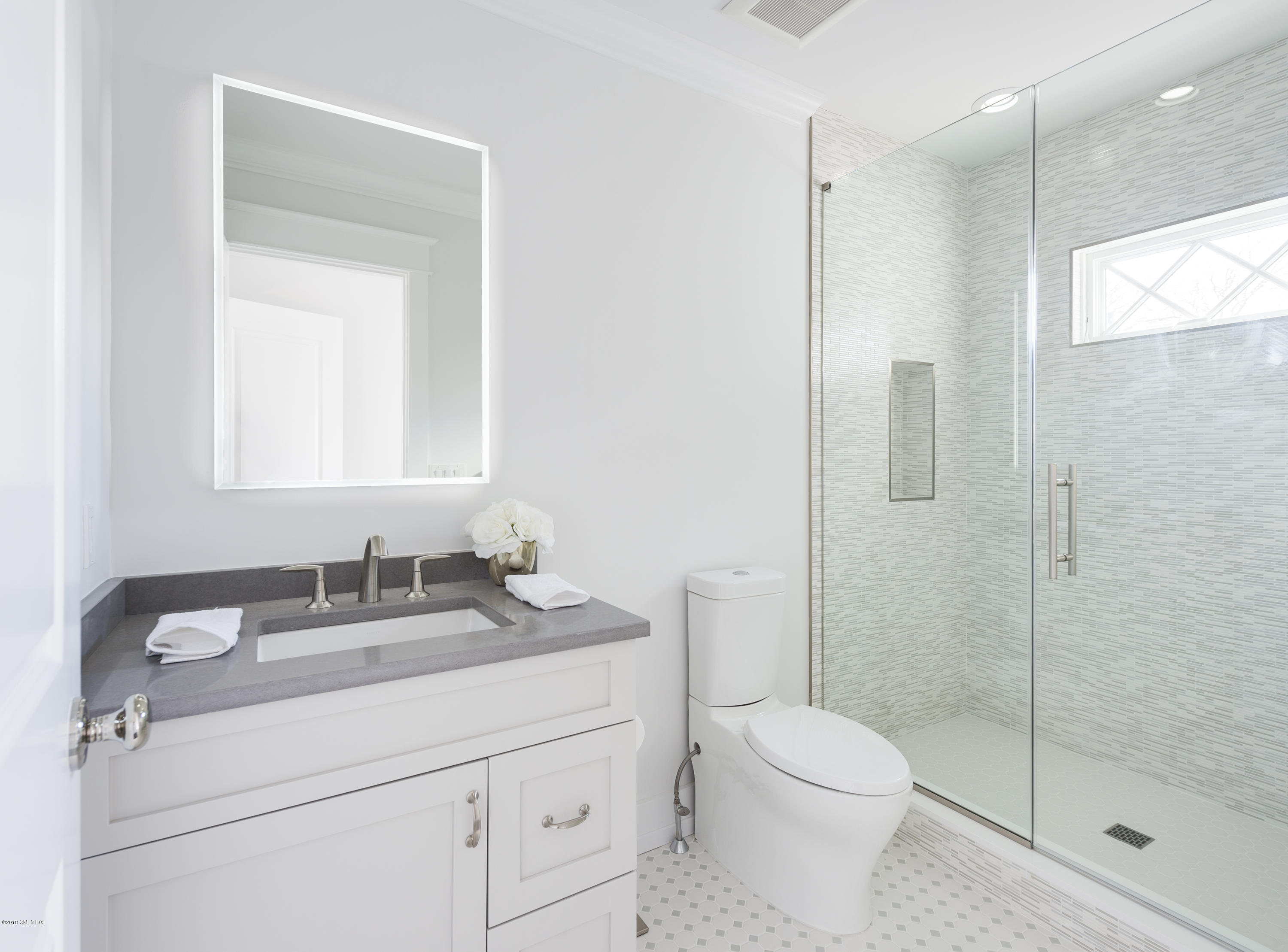 121 Lockwood Road Riverside, CT 06878 - Photo 28 of 40 a bathroom with a granite countertop sink toilet and shower