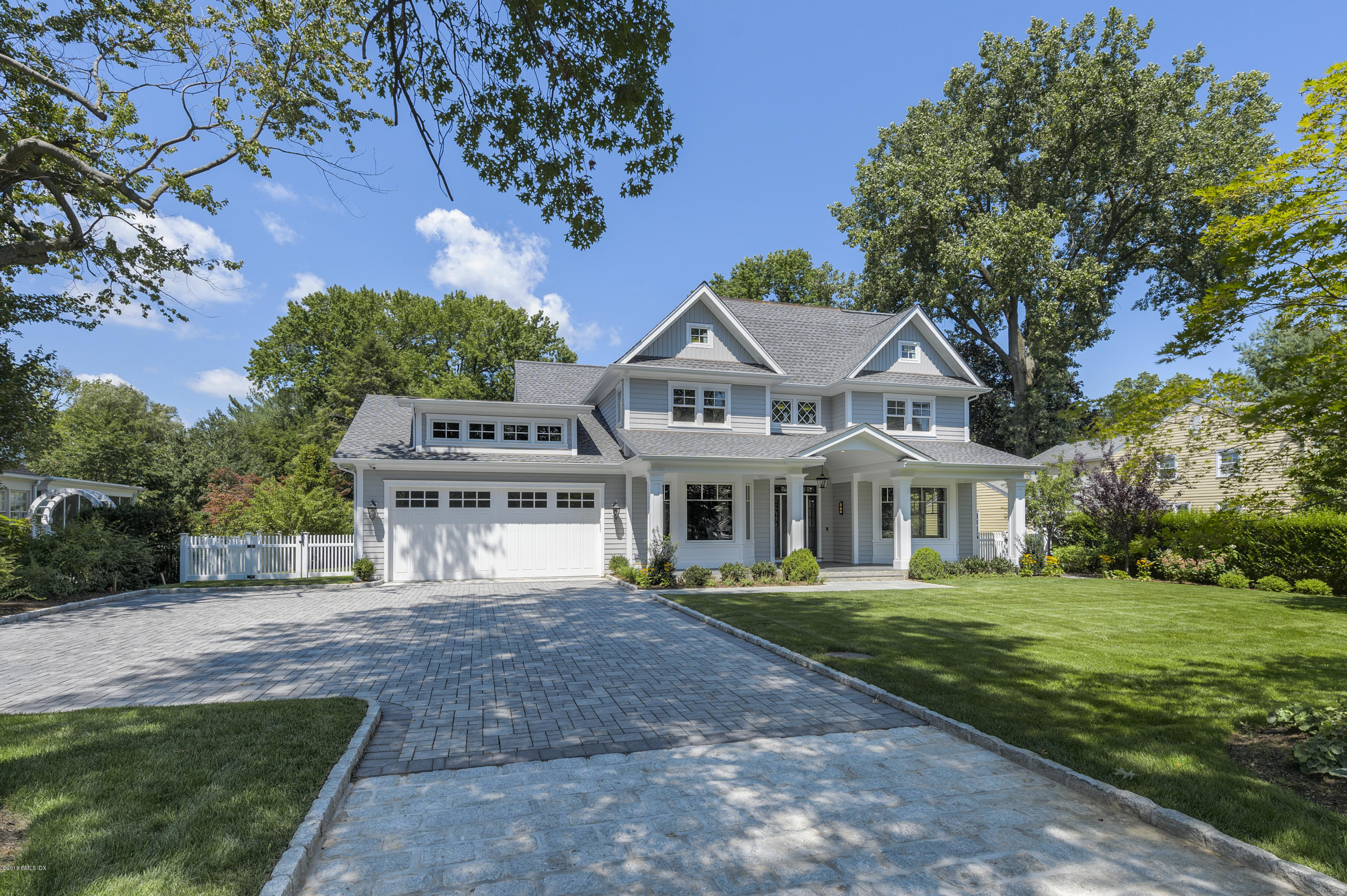 121 Lockwood Road Riverside, CT 06878 - Photo 4 of 40 a front view of a house with a garden