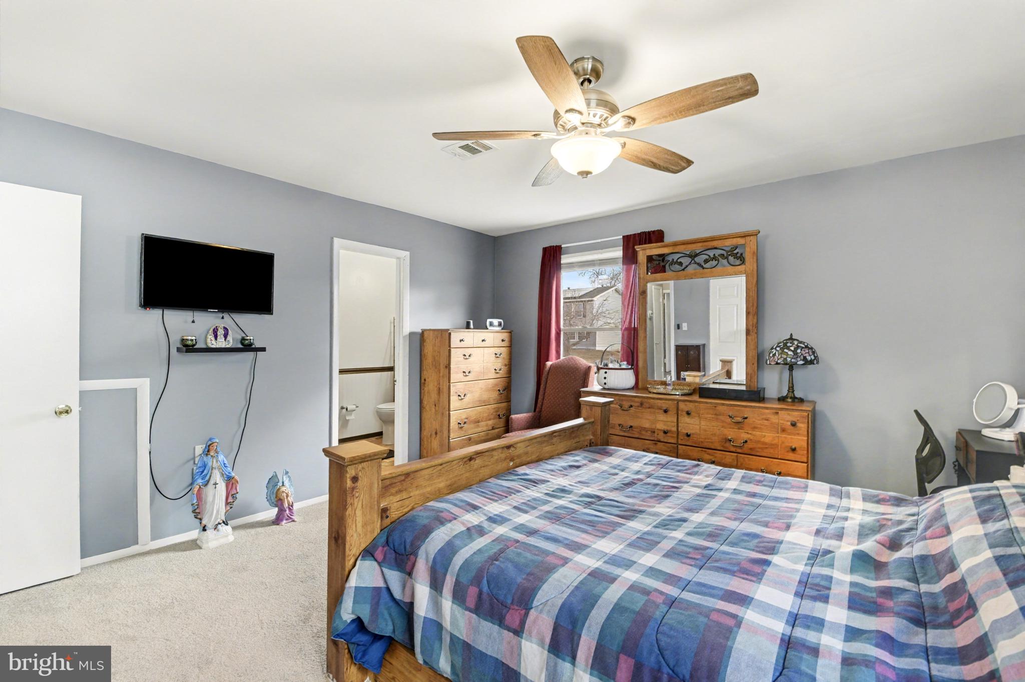 1804 Harbinger Trail Edgewood, MD 21040 - Photo 15 of 29 a bedroom with a bed and a flat screen tv