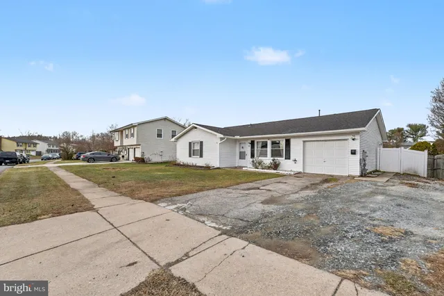 a view of big house with a yard