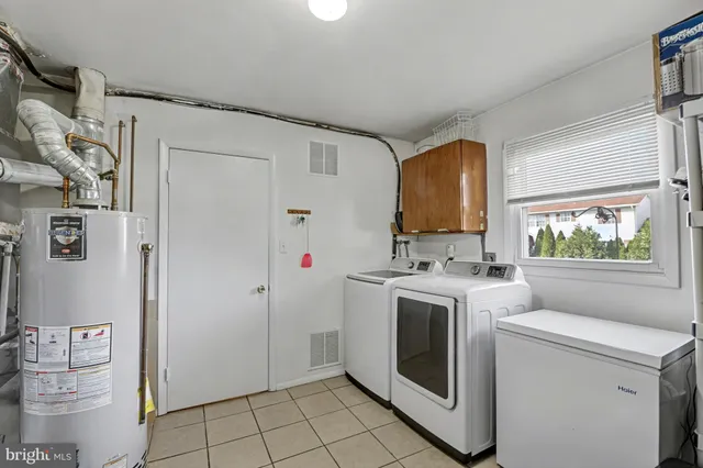 a kitchen with stainless steel appliances a stove a refrigerator and a cabinets