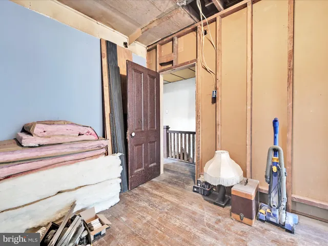 a bed room with a bed and a chair