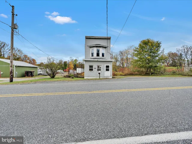 a view of a car parked in front of a building