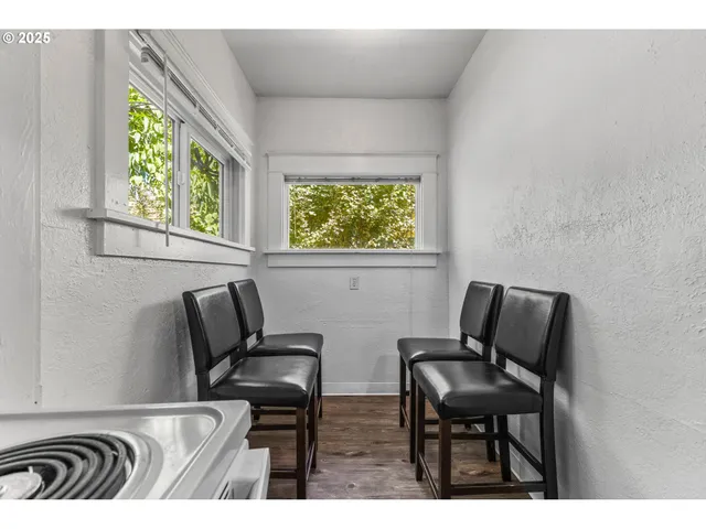 a view of two chairs and a window