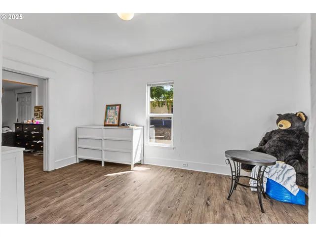 a room with furniture and wooden floor